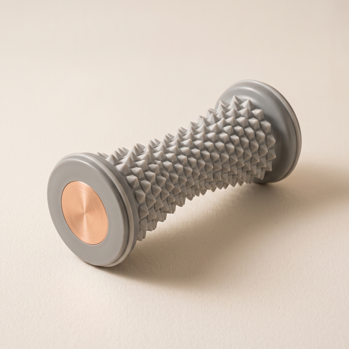 Foot roller on a warm off-white surface